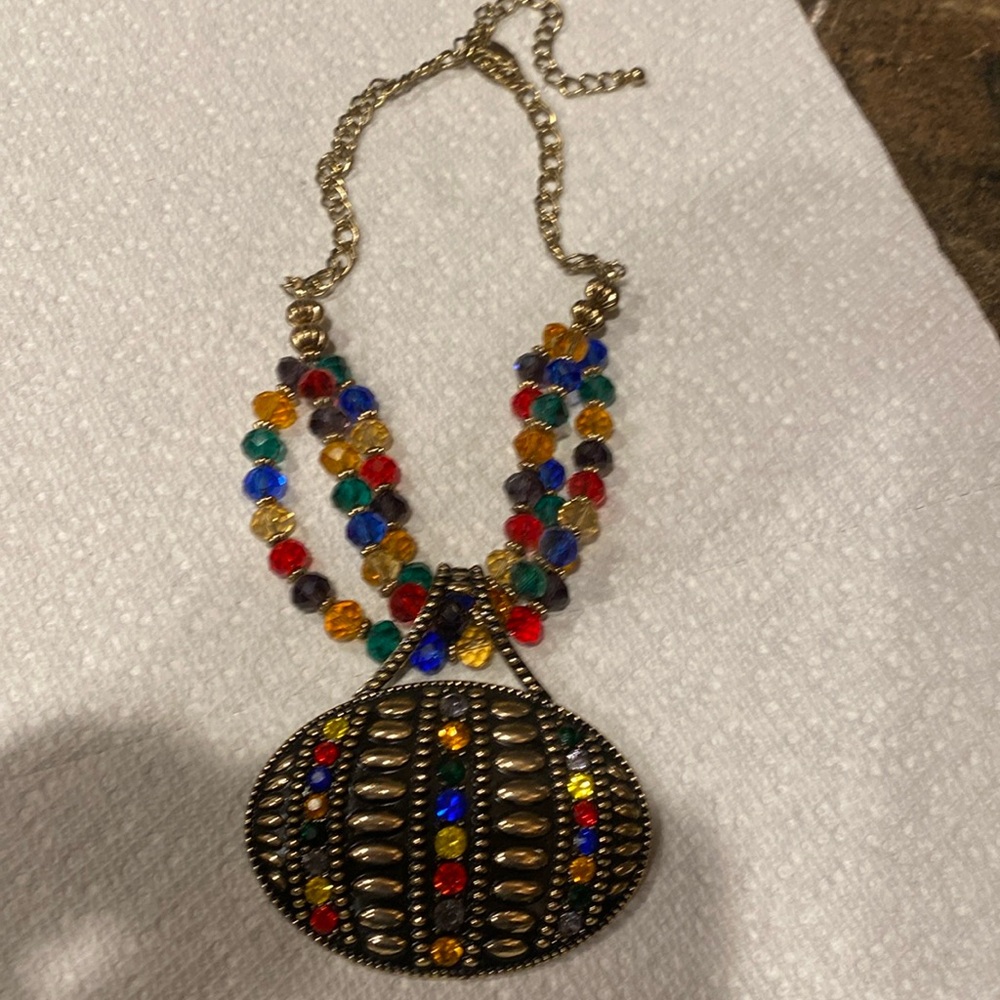 Super cool almost Egyptian looking multi color necklace with beads in the chain